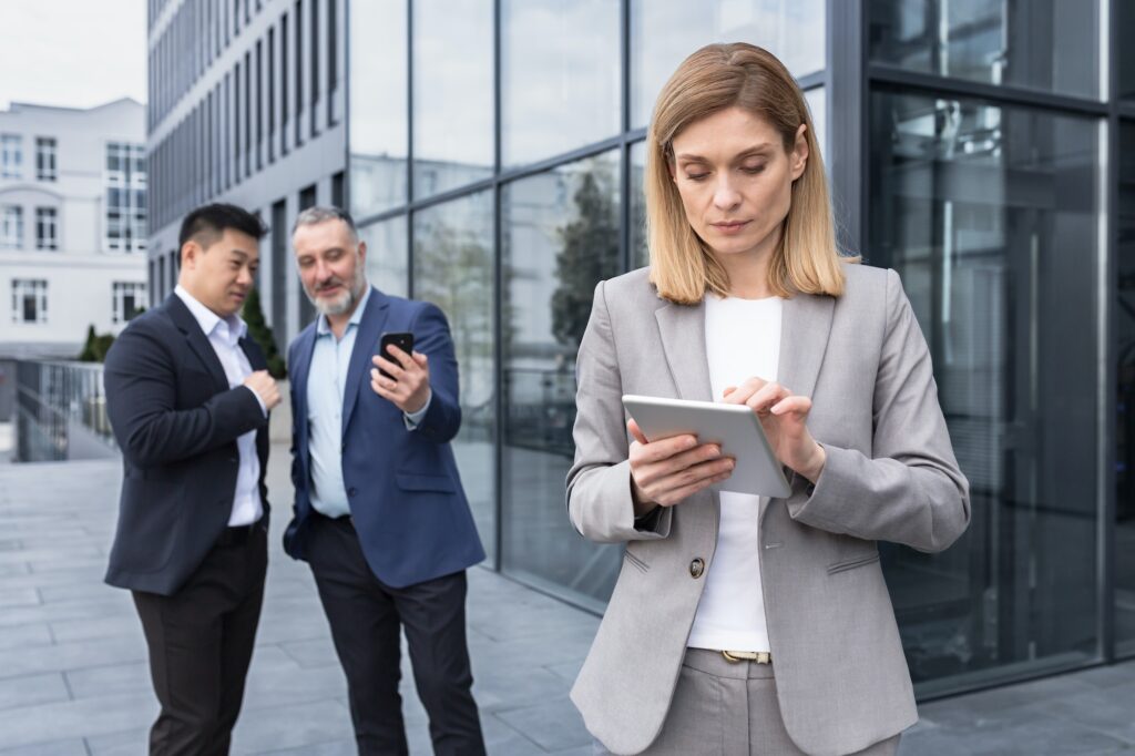 harassment and stalking bullying in the office, business people colleagues men making